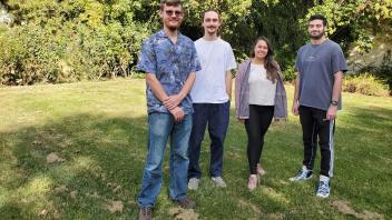 4 people standing around